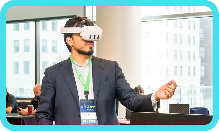 An Ohio VC Fest attendee testing virtual reality technology.